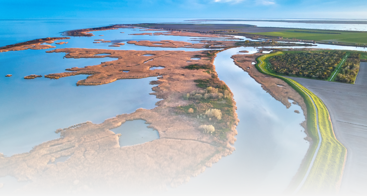 Aerial view of landscape with Ravenna river flowing into the sea